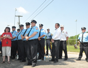 Members of the Newton Fire Department stand at attention.