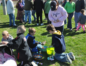 Children look through their treasures in Newton's Memory Park.