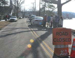 Road closed as recovery efforts continue.