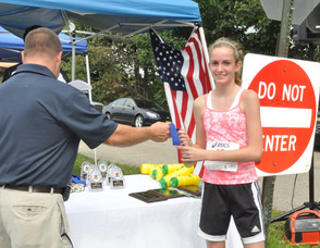 Emma Farinella receives a ribbon.