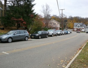 Cars wind their way along lower Spring Street in Newton for the Lukoil.