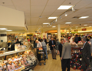 Customers mingle through the deli section.