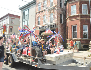 Boy Scouts wave from their float.