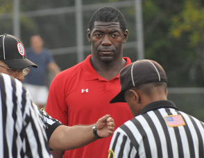 Roman Oben during the coin toss.