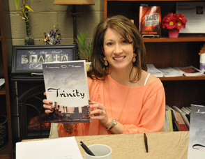 Lauren D. Fraser with her book, "Trinity."