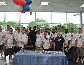 Darryl Strawberry with the staff of Nielsen Dodge Chrysler Jeep Ram.