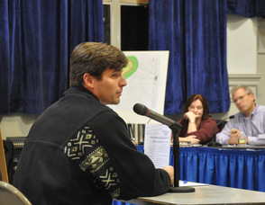 Todd Muth, a township resident, asks a question to the board.
