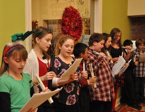 Carolers sing at The Springboard Shoppes.