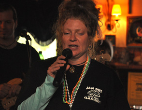 Erin Braun, one of the event organizers, at the microphone.