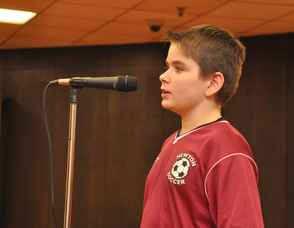 Player Brendan Reed at the microphone.