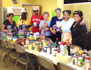 (L-R) Louise LoMonaco, NJCJW, Maudean Young, Pantry Volunteer, Pat Broadie; Pantry Volunteer; Freddie Diemer, Pantry Volunteer; Barbara Hauser, NJCJW, Delores Williams, Vounteer; Donna Presziosi, Volunteer, at Holy Trinity-West Orange Food Pantry