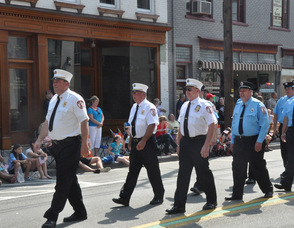 The Newton Fire Department marches down Spring Street.