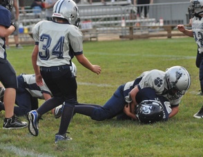 A Kittatinny Cougar tackles a Sparta Spartan during the game.
