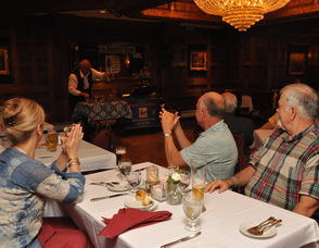 Guests clap as Werner Goebel plays.