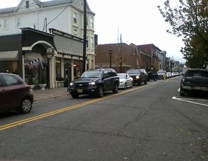 Cars wait on Spring Street for a fill, while others start to turn around.