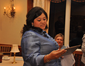 Helen Le Frois reads some preliminary results from an iPad.