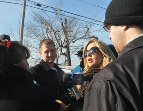 Members of the media interview Betty Marcus.