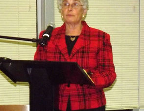 Michelle Barbaro of the League of Women Voters Moderates the Debate.