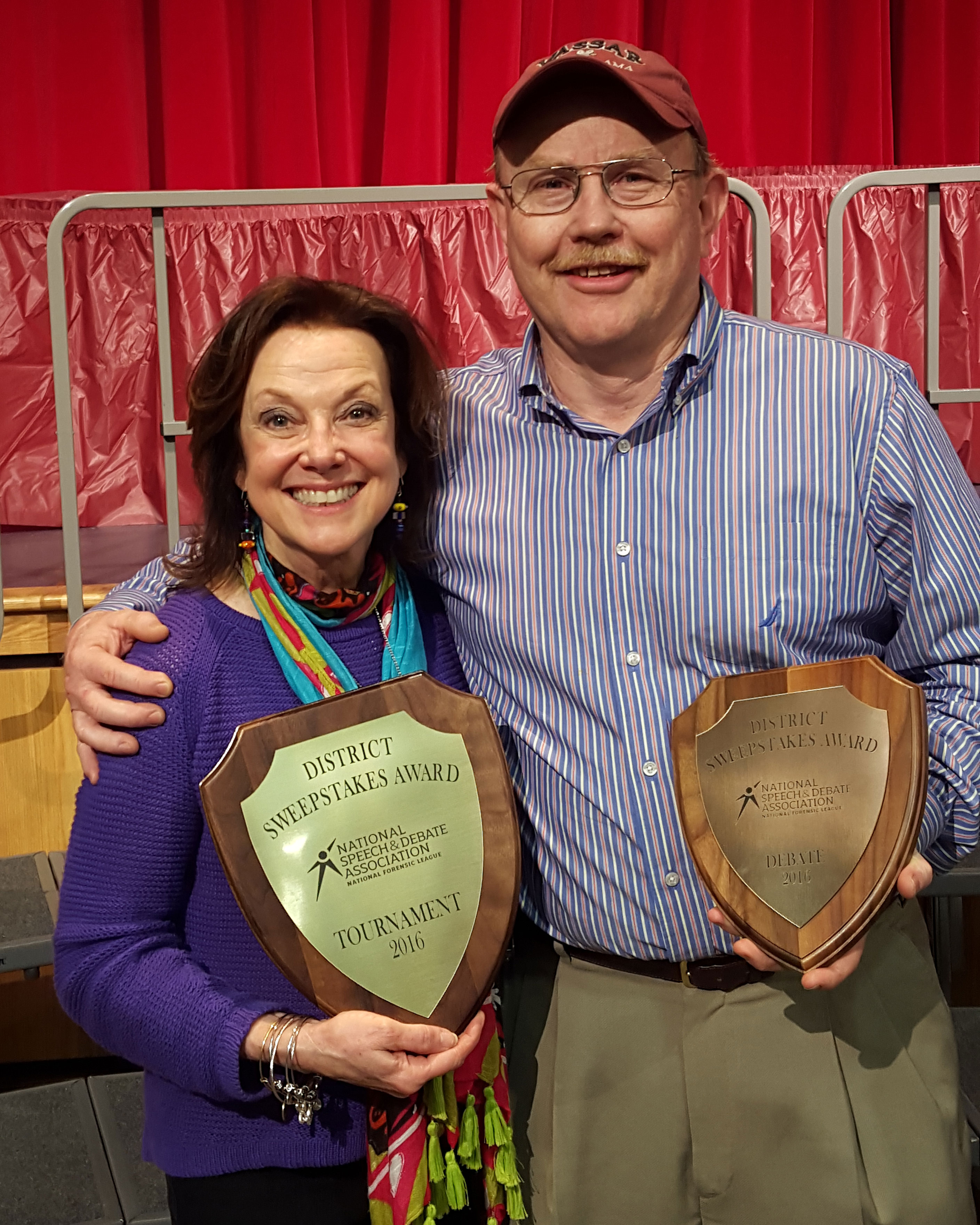 1cb02155ea3629485970_fa16dd3789c6d73d6c5d_anne-and-jim-with-districts-plaques.jpg