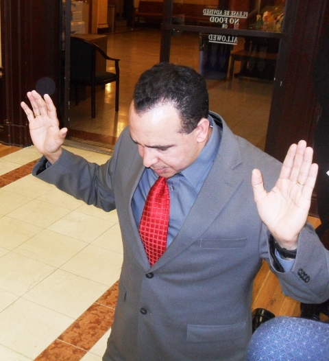 b45d121c1b852168e762_ap_prayer_at_city_hall.__man_kneels_praying_for_peace_at_City_Hall.jpg