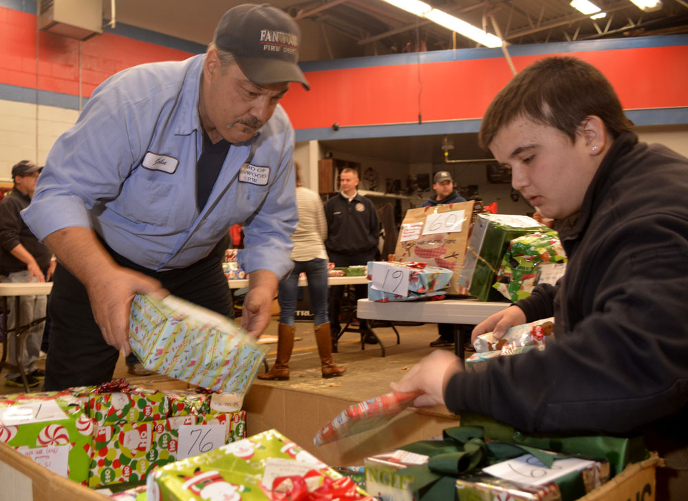 479e3932f2e330edcfec_Fanwood_Fire_Dept._Chief_John_Piccola_with_volunteer_Dante_Clausen.jpg