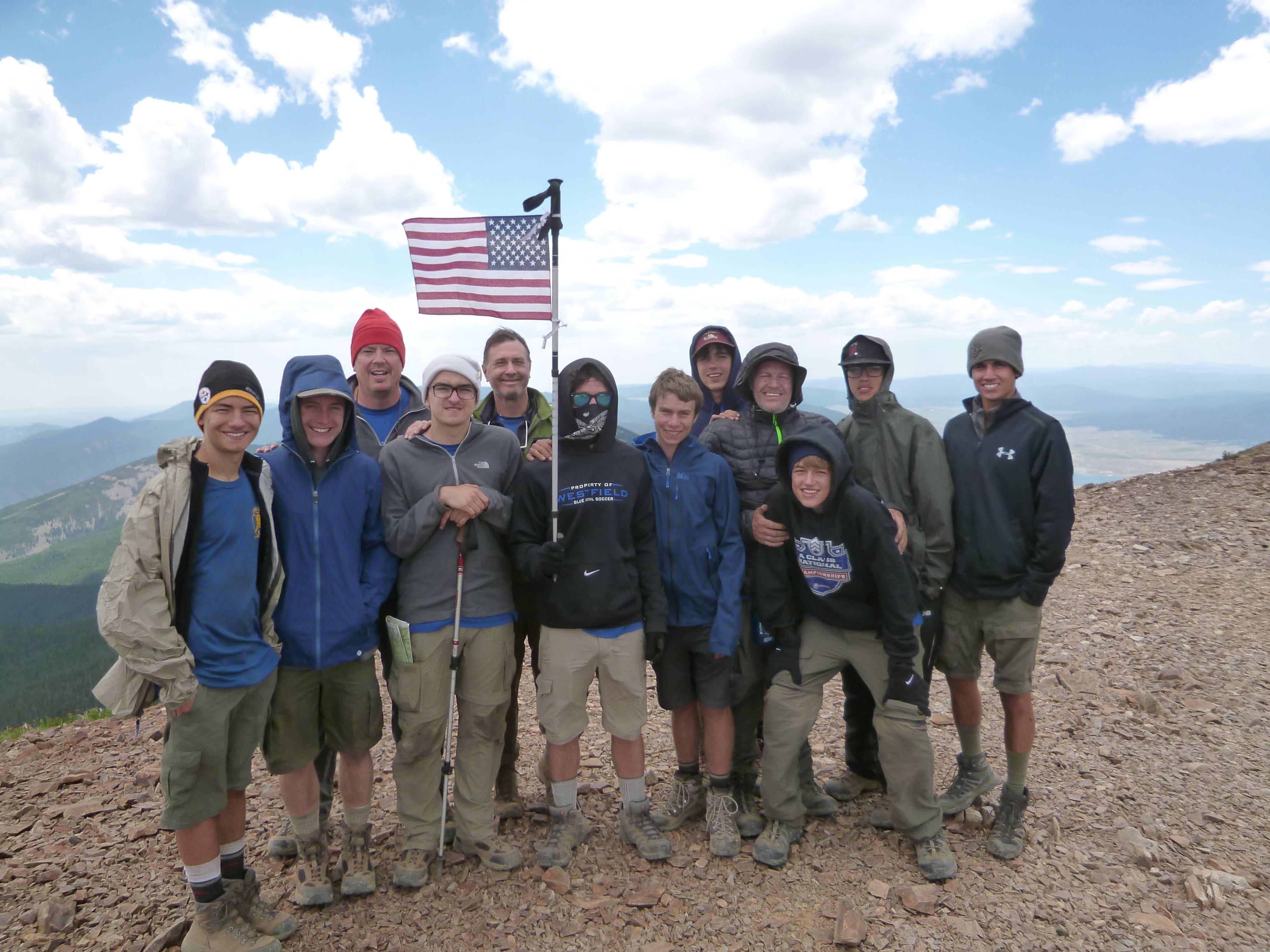 1f6c290a4251ca2f99ea_787ac6b368b9020d80aa_Philmont_pic_at_top_of_Baldy.jpg