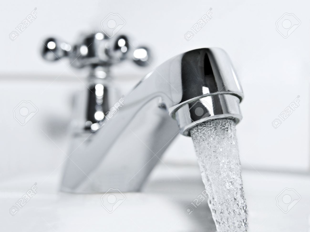 f990096d4ac526b02ef6_28013809-drinking-water-flows-from-a-chrome-water-tap--Stock-Photo.jpg