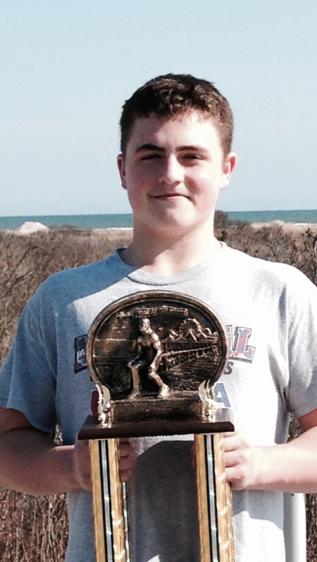 eb3aaf4153efbb8d325d_Luke_Niemeyer_Holds_His_War_at_the_Shore_1st_Place_Trophy_-_Picture.jpg