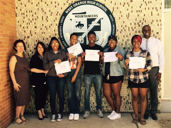 e6f8af4fbfd0dcbc25cc_Business_Education_teacher_Anne_Hanson___ECBA_Nina_Peckman__Chyna_Chitty__Rickey_Close__David_Noelvil__Femi_Ojo__Anastasia_Adams_and_Principal_Hayden_Moore..jpg