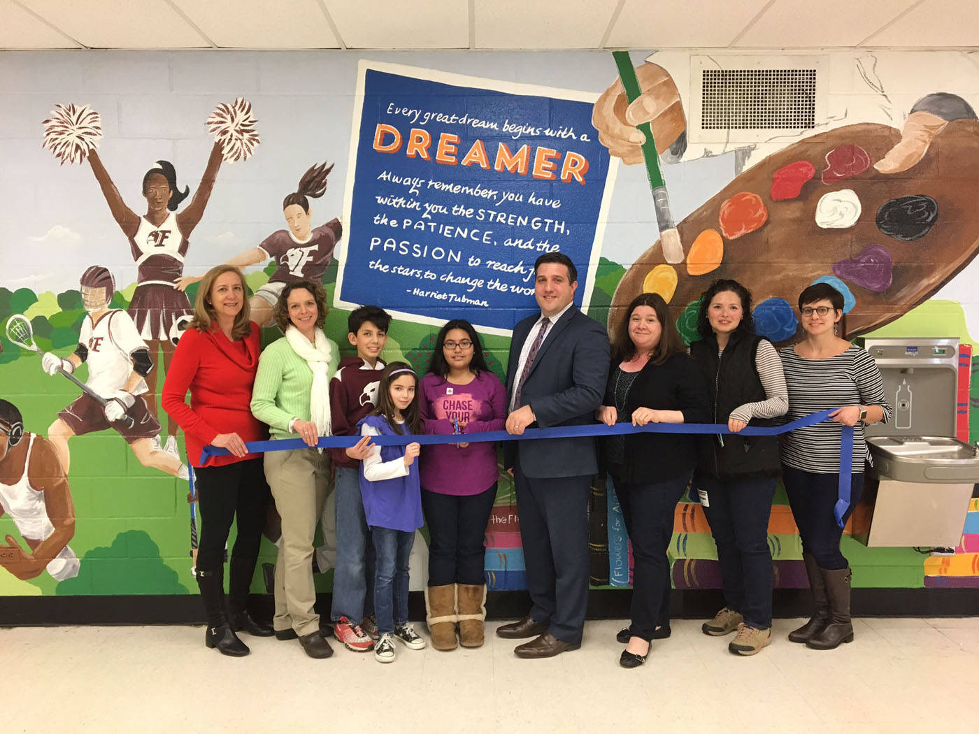 02b04142ef25e0a84dd9_86af7d49a813e6c2762f_FMS_MURAL_RIBBON_CUTTING.jpg