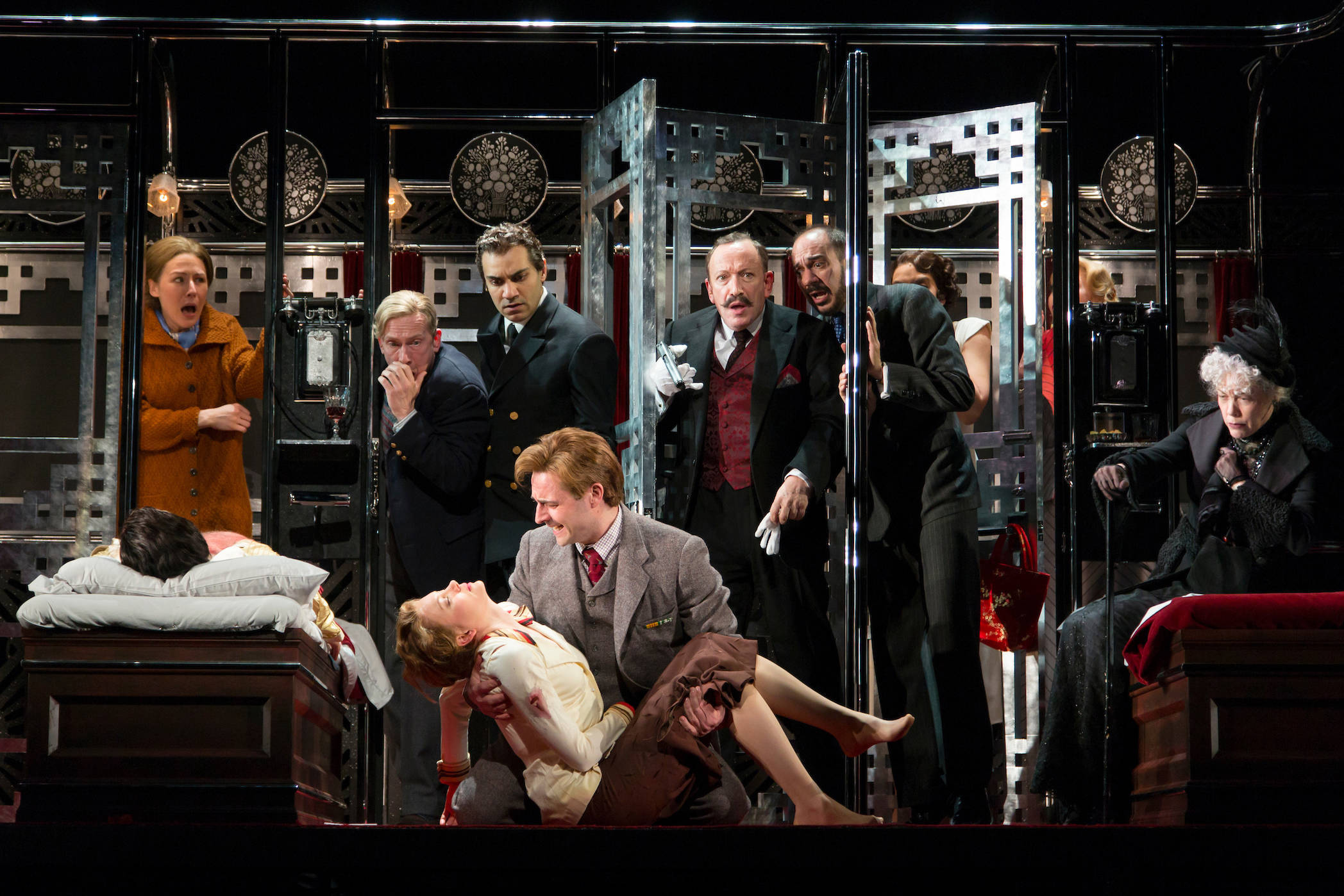 04830780d18b41aceb36_Allan_Corduner__Hercule_Poirot__center__with_the_Company_of_Murder_on_the_Orient_Express._Photo_-_T._Charles_Erickson.jpg