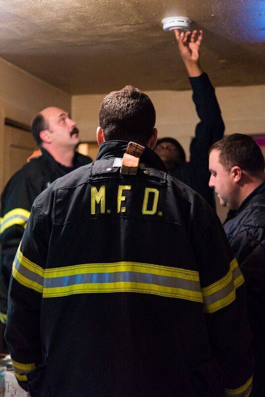 11d5ab767a567ed00842_Firefighters_Install_Smoke_Detector.jpg