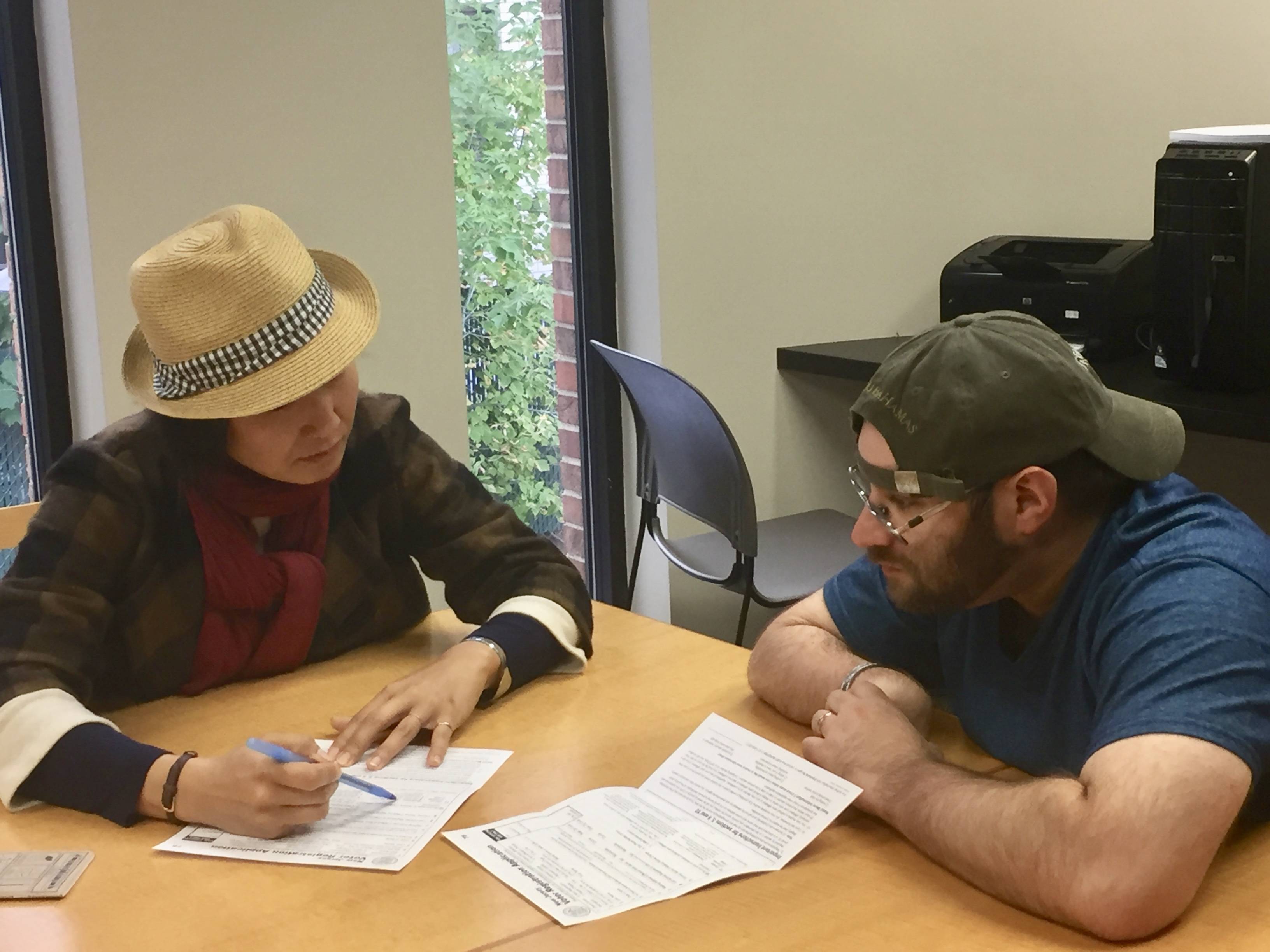 164b17dba9a54f997769_J_H_-_1_Hyon_Training_Michael_J_to_help__others_register_to_vote.jpeg