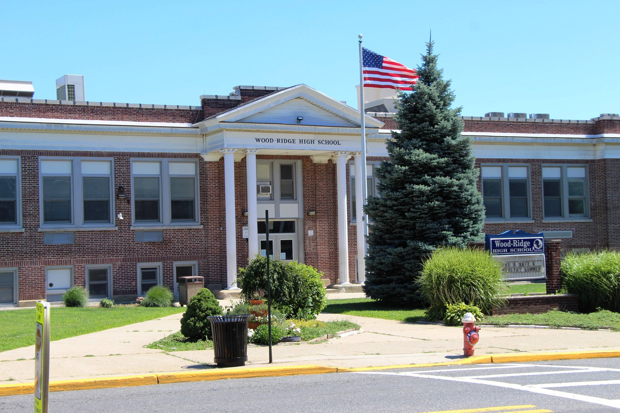 29d2989fa406e9630d24_EDIT_mid_shot_WR_HS_front_door_sign_flag.jpg