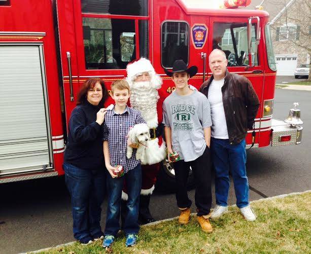 41b863e11a1f982d678e_SantaOnLCFiretruck.jpg