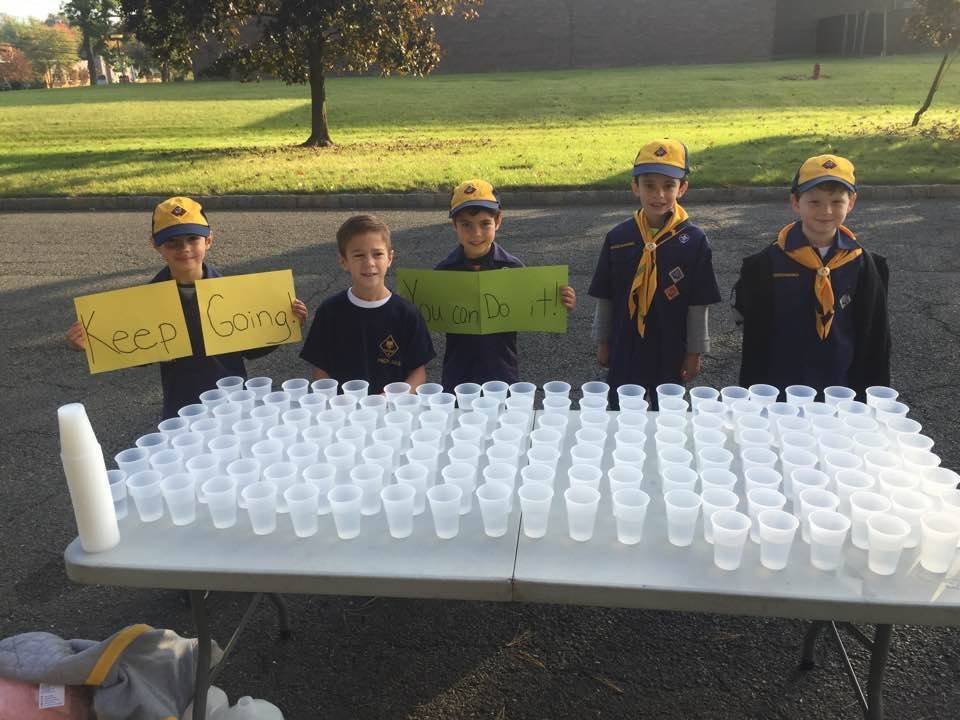 492948cdbd73eaf5385c_Cub_Scouts_supporting_runners_in_the_NPEF_s_Strides_for_Students_5K_event..jpg