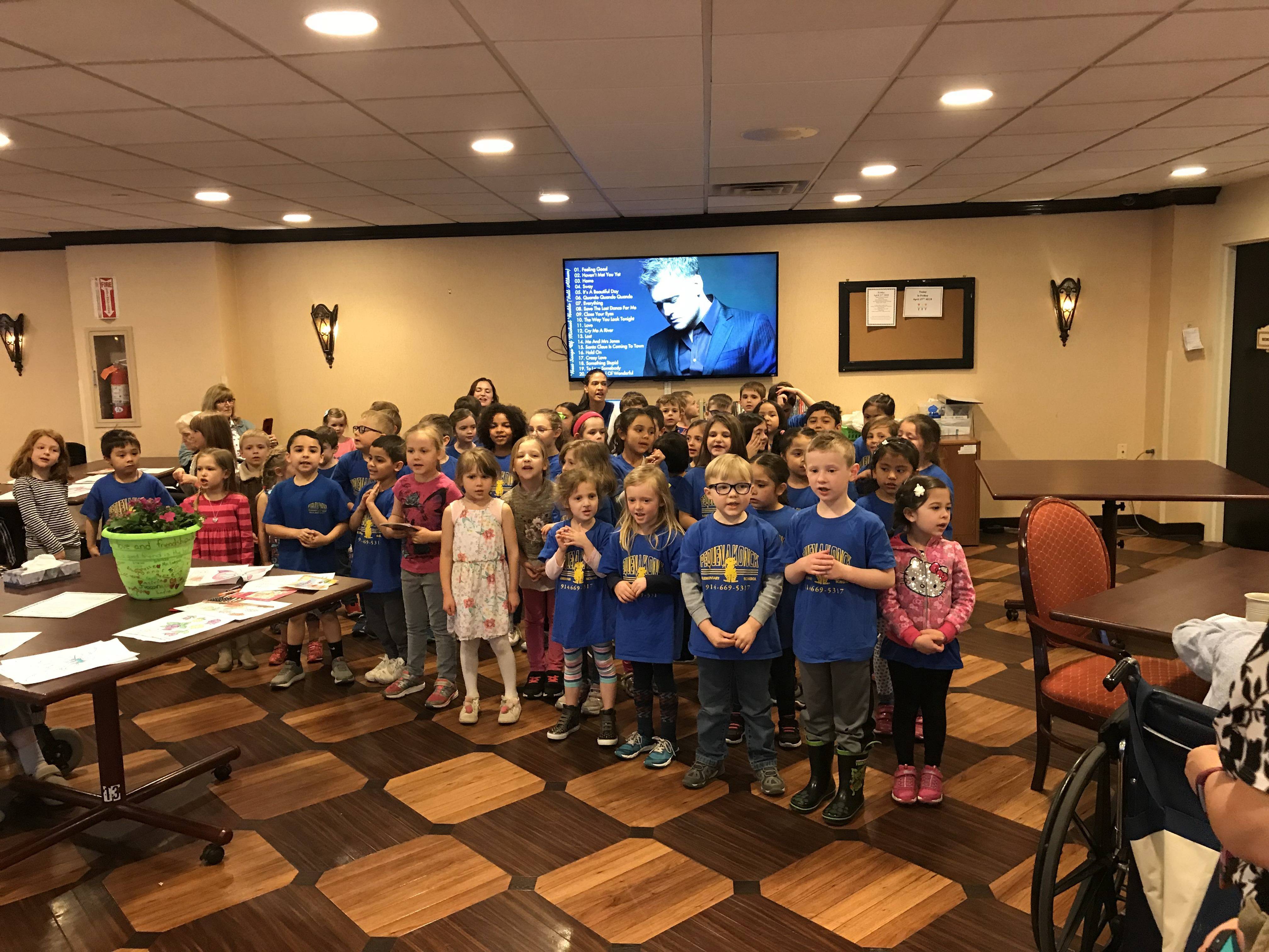 50b054c563392a65f44b_The_children_perform_a_mini_concert_for_the_seniors.jpg