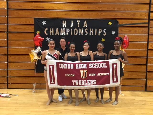 51de5e7e595581f38ed7_00a44db7c1e17d3aba59_ff03bfd1219f32444d3f_twirlers_njta_champs.jpg