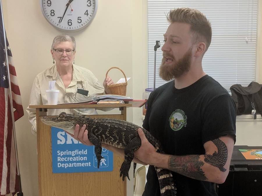 61e4eb8d8ffef54c8835_SrRizzo_s_Reptiles_with_a_baby_American_Alligator.jpg