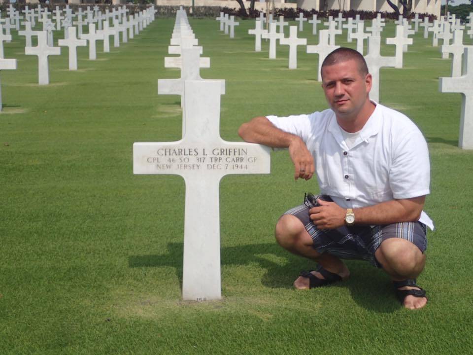 624c7fb0b31cdec2f3ec_Drew_at_Uncle_Charlie_s_grave.jpg