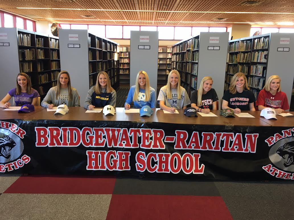 6452129a7f25798824f3_girls_lacrosse_signing.jpg