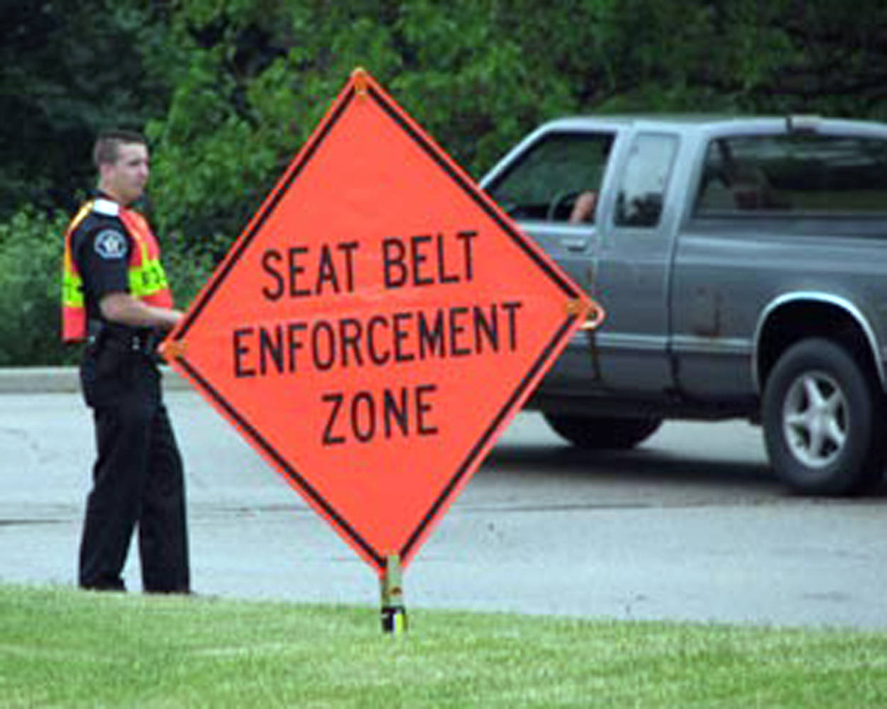 66003d92e10edcb98cb7_sompixseatbeltsign.jpg