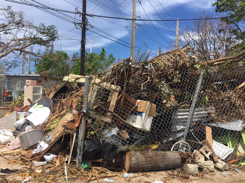 776cc7d1503ad5b4ce11_Debris_behind_fence_2.jpg