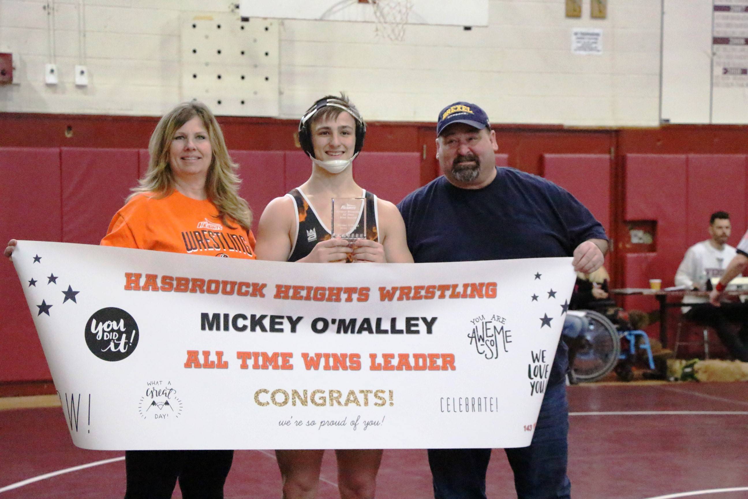 8514c7cdac33aa296b86_EDIT_Mickey_with_parents_sign.jpg