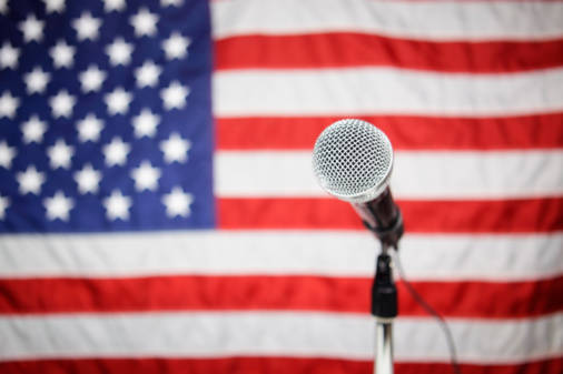 8b5e562e077a00d2bedb_20130227_first_amendment_microphone_usa_flag_large.jpg