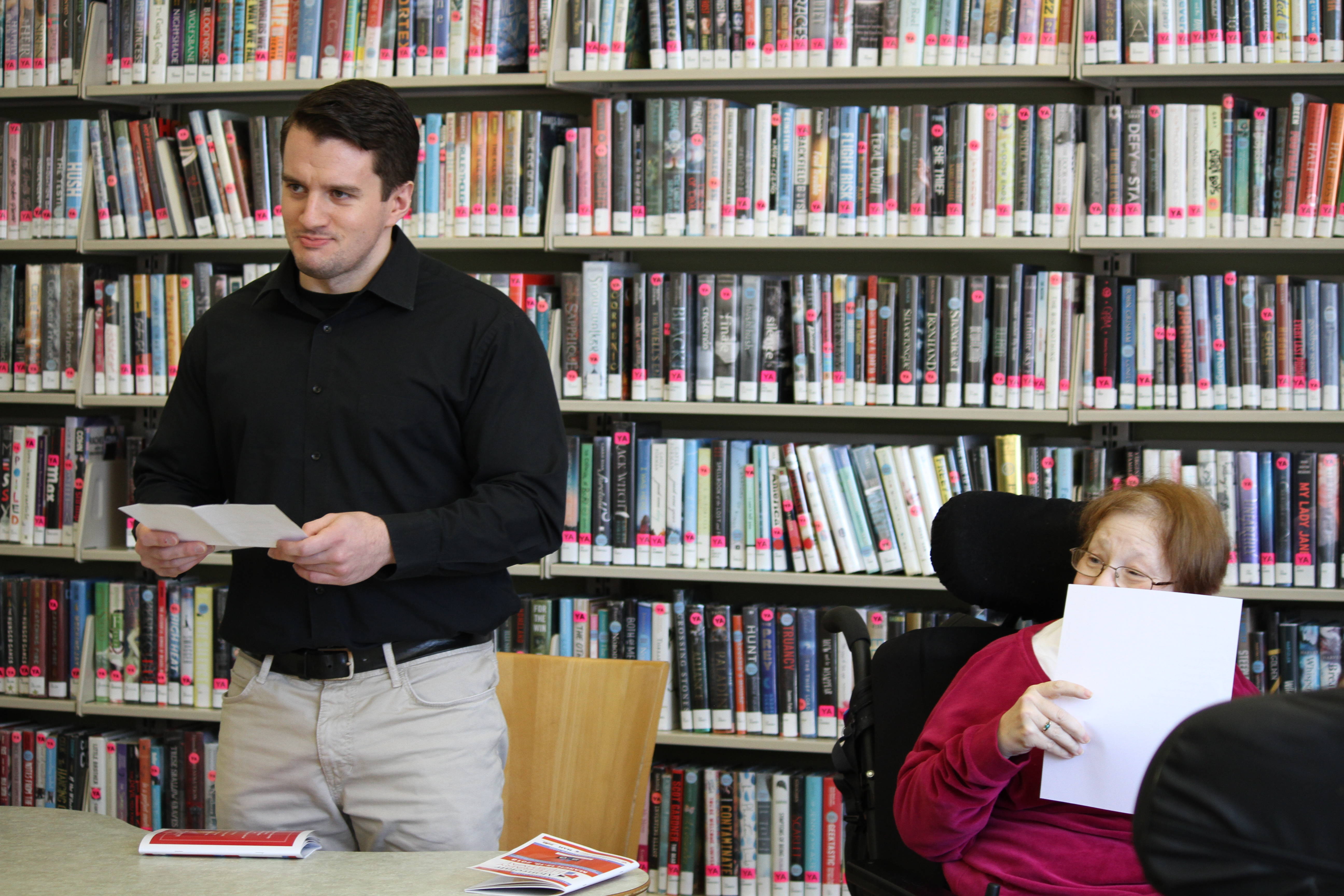 c5a7ee627650237fb6b6_Mike_recites_the_work_of_writer_Cheryl_Chapin_at_the_Montclair_Literary_Festival.jpg