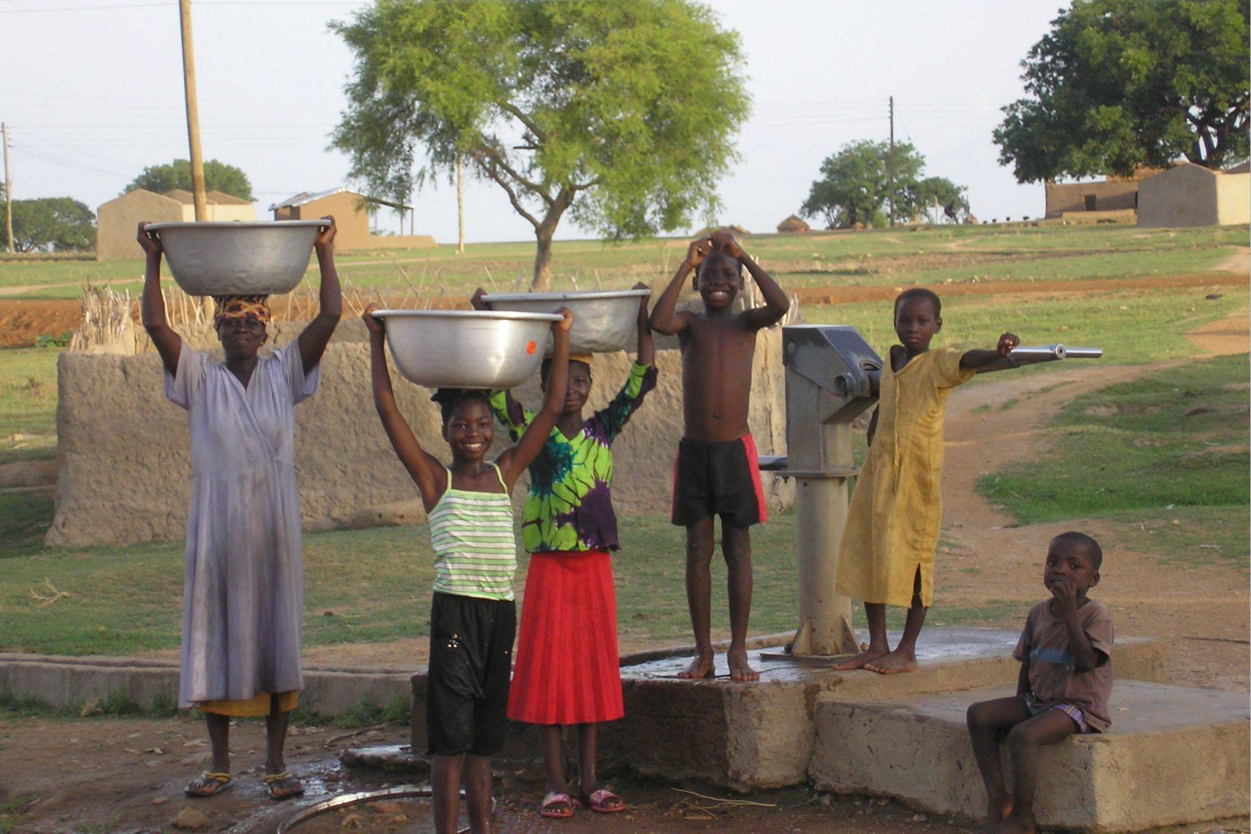 c852124cfa83c5dcb7b7_Outreach_-_Clean_water_-_kids-and-well_in_Ghana__Harvey_Wang_ERD__.original.jpg