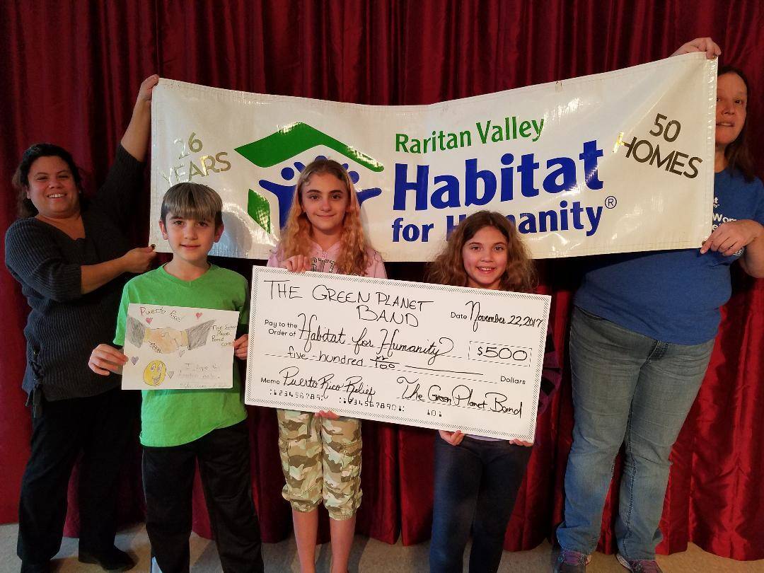 cc949b77e80b5fb943e1_TheGreenPlanet_HabitatForHumanity_PuertoRico_KyleeTylerAnnaLisa_Laura_20171122_Pic2.jpg