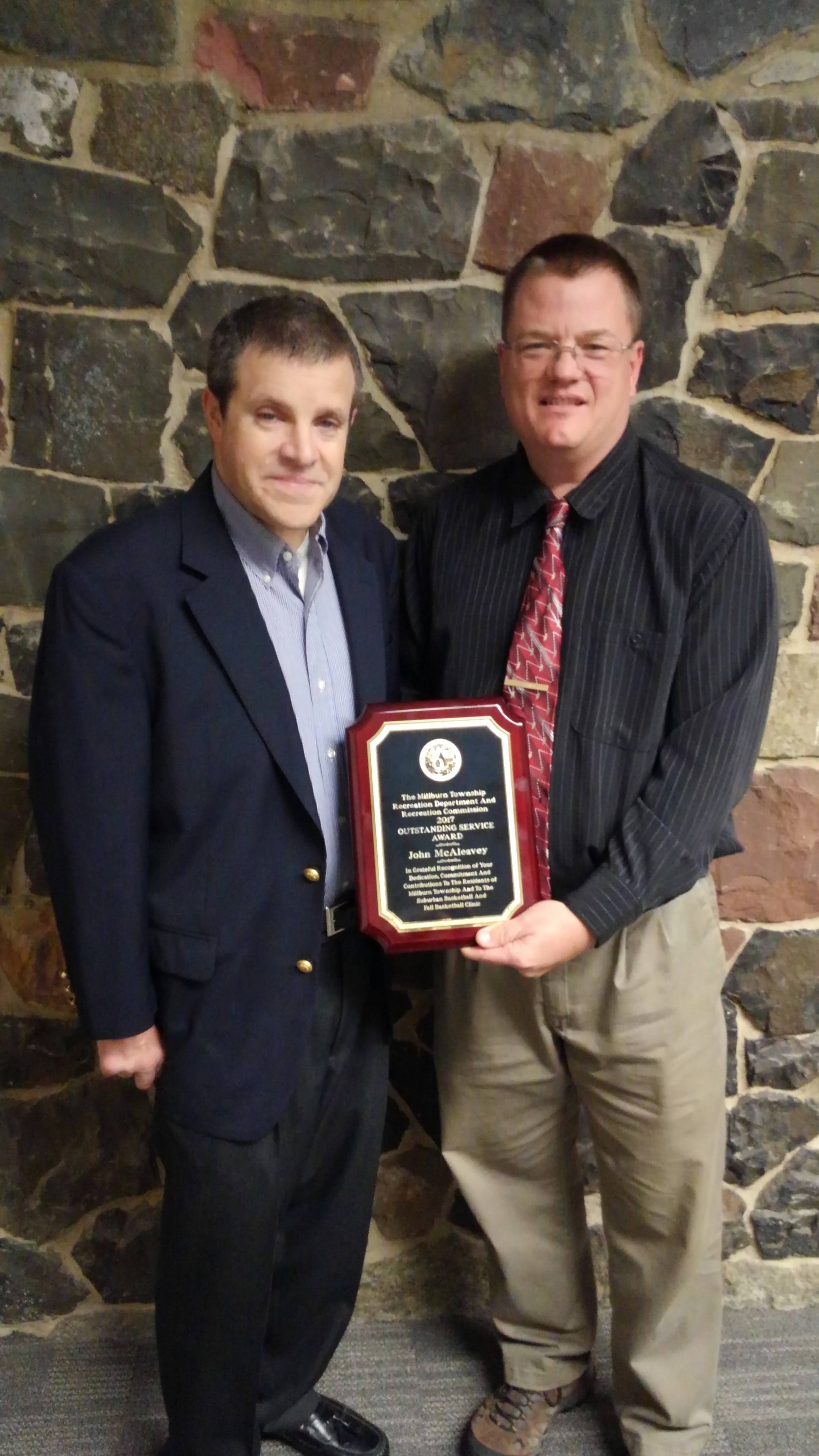 dcc0421a2c325b93af36_Outstanding_Service_Award_-_John_McAleavey_2017.jpg