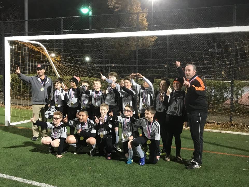 dd325bf33d154d86e66a_EDIT_2017_U12_Boys_soccer_champs.jpg